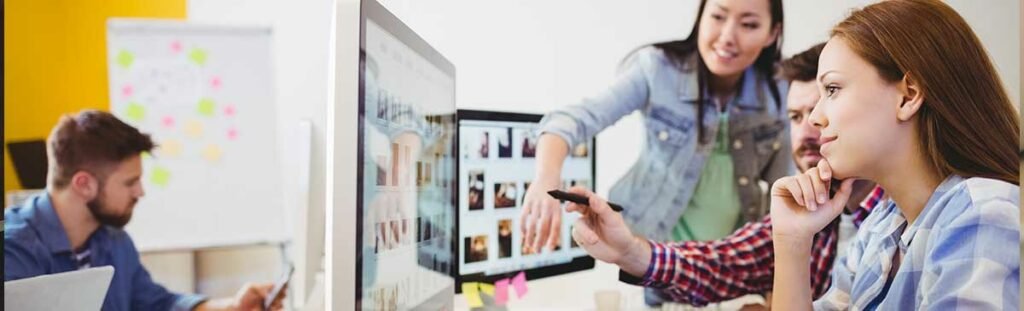 FAQs About Hiring A Digital Marketing Agency 4 Photo business people working with computers